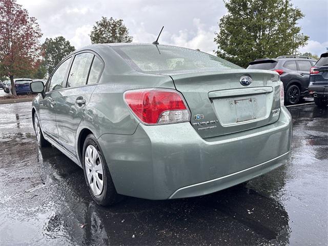 Photo of 2014 Jasmine Green Metallic Subaru Impreza