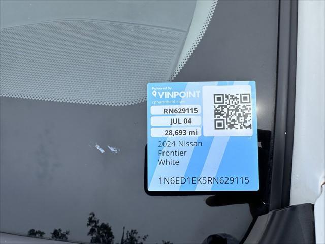 Photo of 2024 Glacier White Nissan Frontier