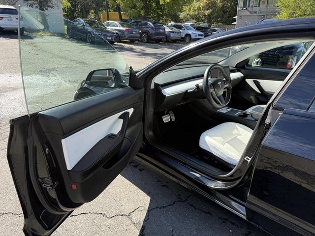 Photo of 2021 Solid Black Tesla Model 3