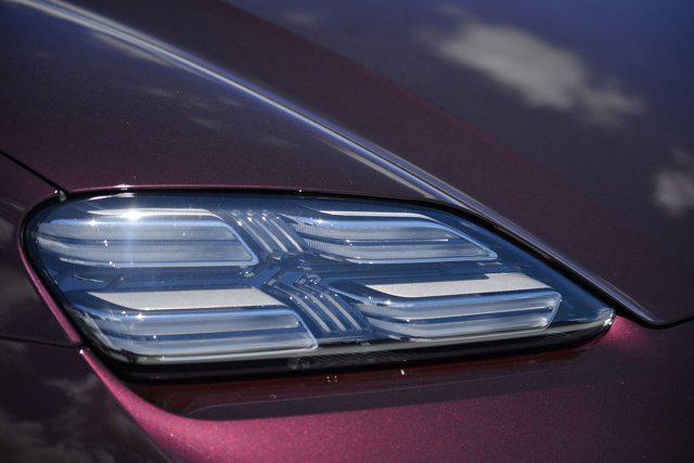 Photo of 2025 Copper Ruby Metallic Porsche Macan