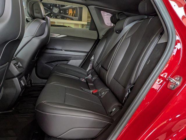 Photo of 2025 Monarch Orange Cadillac OPTIQ