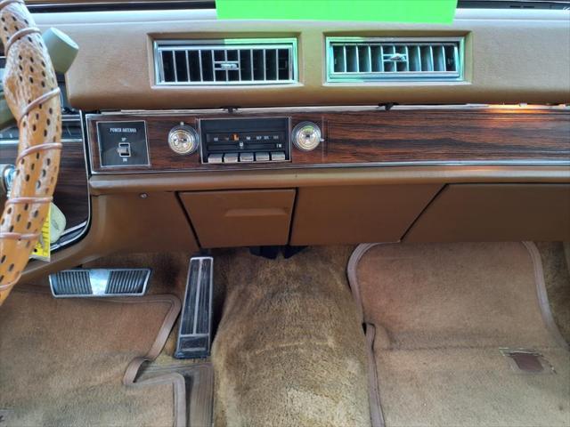 Photo of 1976 Yellow Cadillac DeVille
