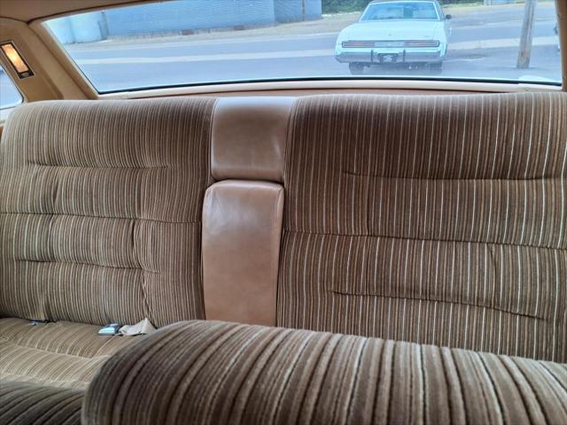 Photo of 1976 Yellow Cadillac DeVille
