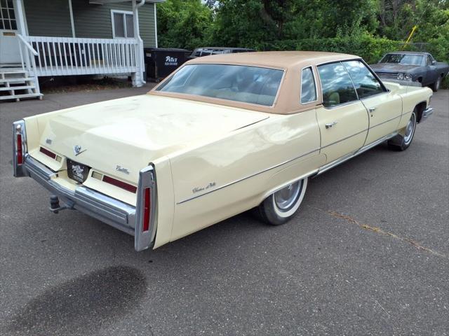 Photo of 1976 Yellow Cadillac DeVille