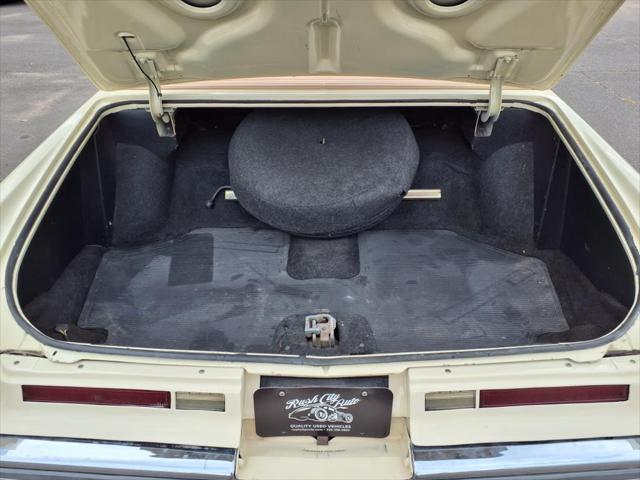 Photo of 1976 Yellow Cadillac DeVille