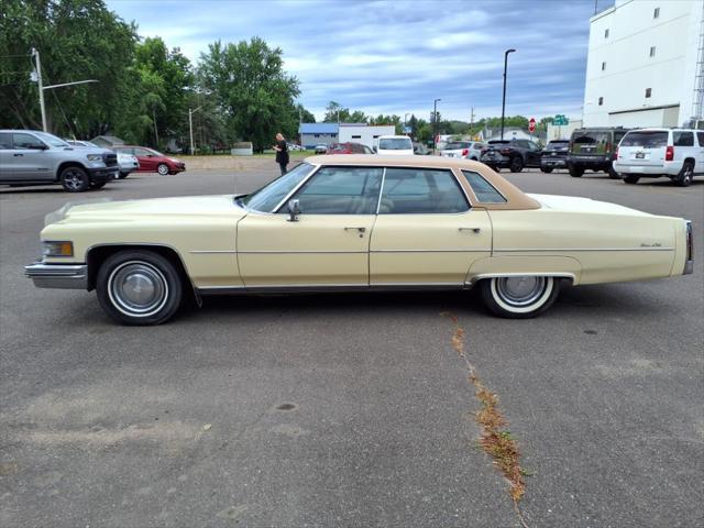 Photo of 1976 Yellow Cadillac DeVille