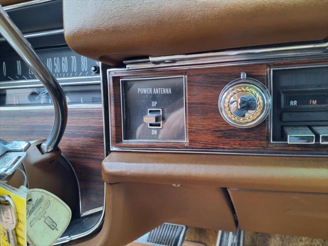 Photo of 1976 Yellow Cadillac DeVille