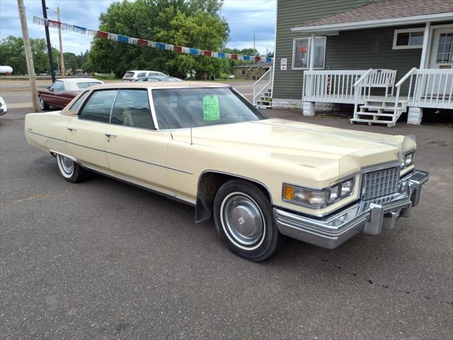 Photo of 1976 Yellow Cadillac DeVille
