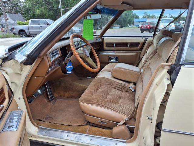 Photo of 1976 Yellow Cadillac DeVille