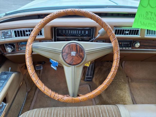 Photo of 1976 Yellow Cadillac DeVille