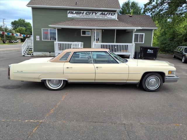 Photo of 1976 Yellow Cadillac DeVille