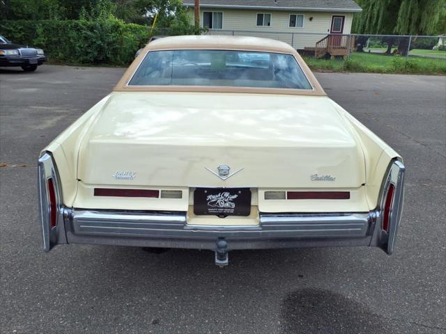 Photo of 1976 Yellow Cadillac DeVille