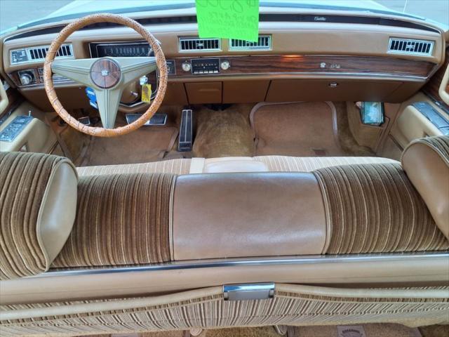 Photo of 1976 Yellow Cadillac DeVille