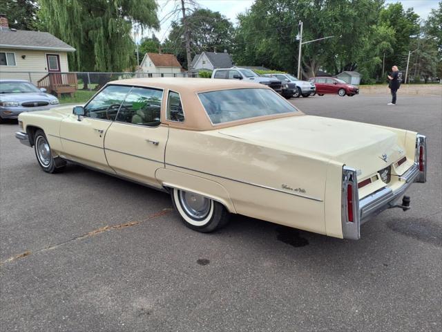 Photo of 1976 Yellow Cadillac DeVille