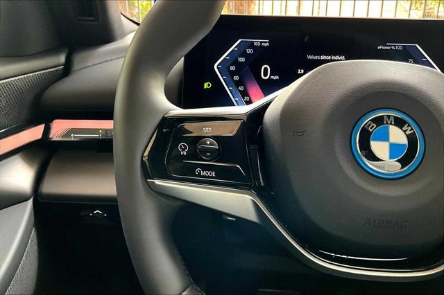 Photo of 2024 Black Sapphire Metallic BMW i5