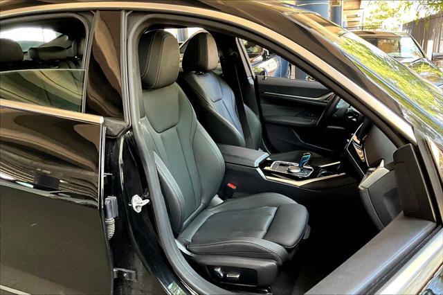 Photo of 2022 Black Sapphire Metallic BMW i4 Gran Coupe