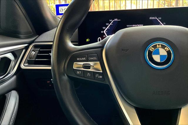 Photo of 2022 Black Sapphire Metallic BMW i4 Gran Coupe