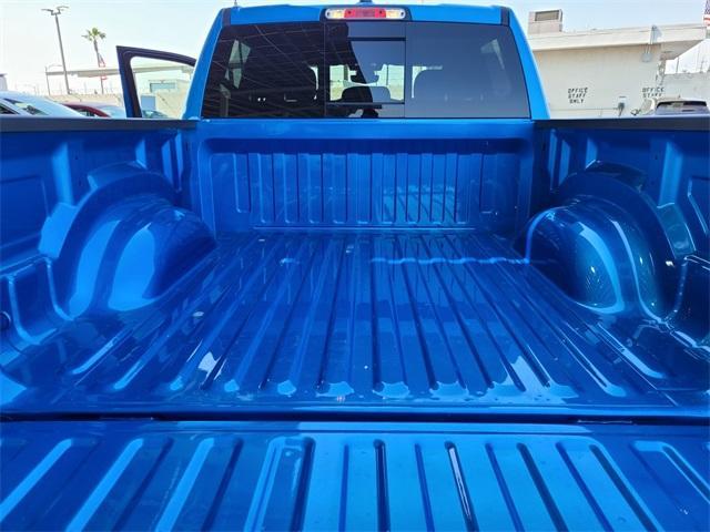 Photo of 2024 Hydro Blue Pearlcoat RAM 1500