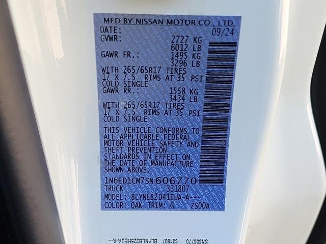 Photo of 2025 Glacier White Nissan Frontier