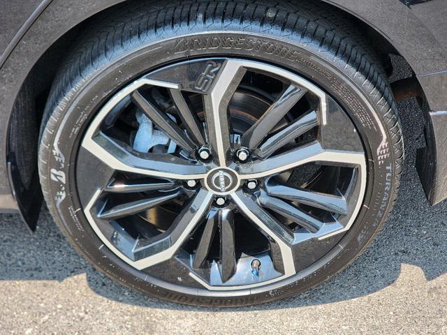 Photo of 2024 Super Black Clearcoat Nissan Altima