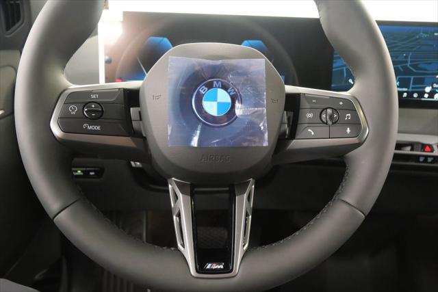 Photo of 2025 Black Sapphire Metallic BMW iX