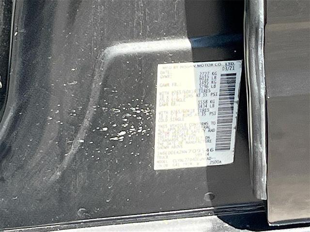 Photo of 2021 Magnetic Black Pearl Nissan Frontier