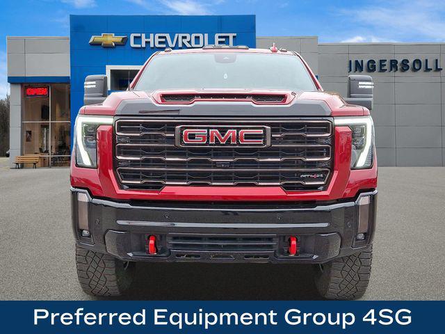 Photo of 2024 Volcanic Red Tintcoat GMC Sierra 2500