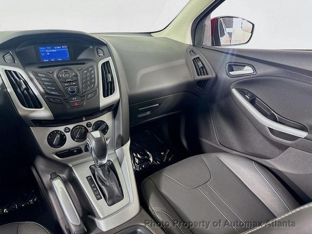 Photo of 2014 Ruby Red Tinted Clearcoat Ford Focus