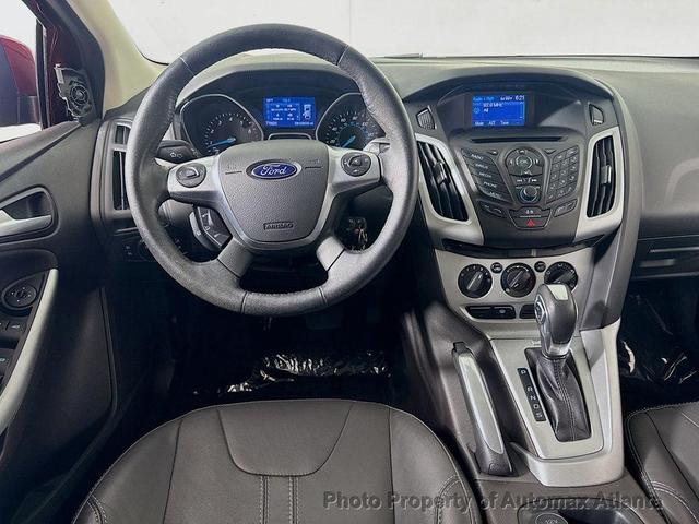 Photo of 2014 Ruby Red Tinted Clearcoat Ford Focus