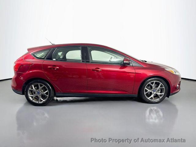 Photo of 2014 Ruby Red Tinted Clearcoat Ford Focus