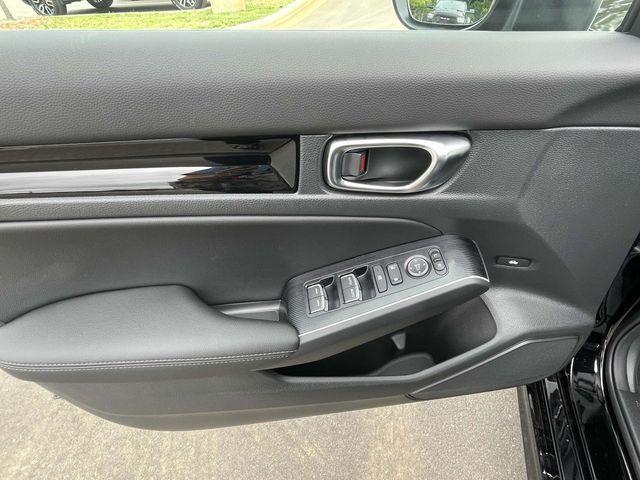 Photo of 2025 Boost Blue Pearl Honda Civic Hybrid