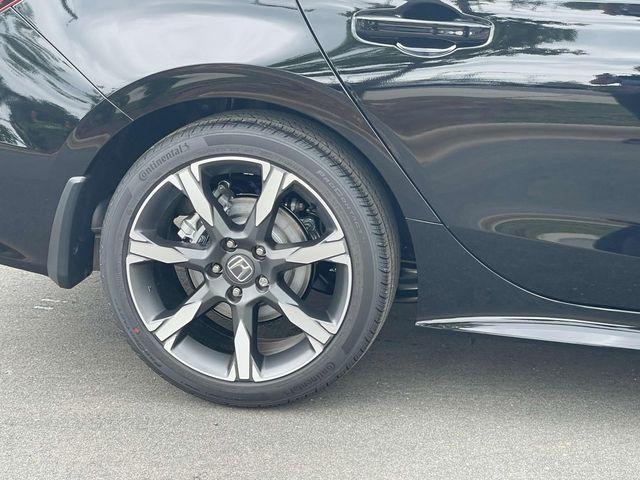 Photo of 2025 Boost Blue Pearl Honda Civic Hybrid