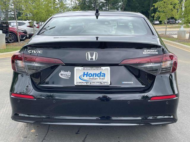 Photo of 2025 Boost Blue Pearl Honda Civic Hybrid