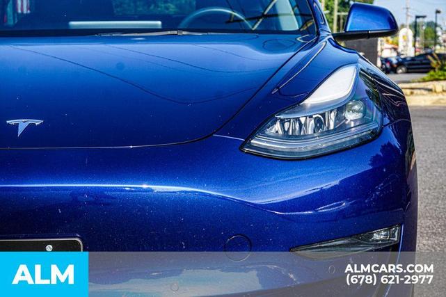 Photo of 2022 Deep Blue Metallic Tesla Model 3