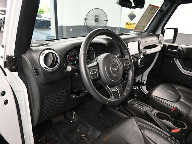 Photo of 2016 Bright White Clearcoat Jeep Wrangler