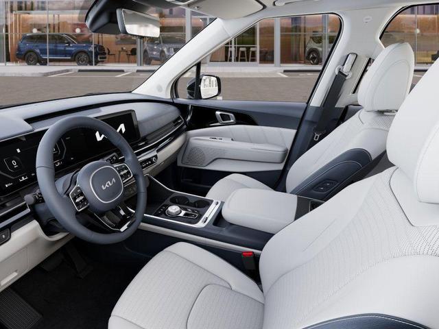 Photo of 2025 Ivory Silver Kia Carnival Hybrid