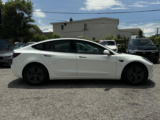Photo of 2021 Pearl White Multi-Coat Tesla Model 3