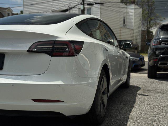 Photo of 2021 Pearl White Multi-Coat Tesla Model 3