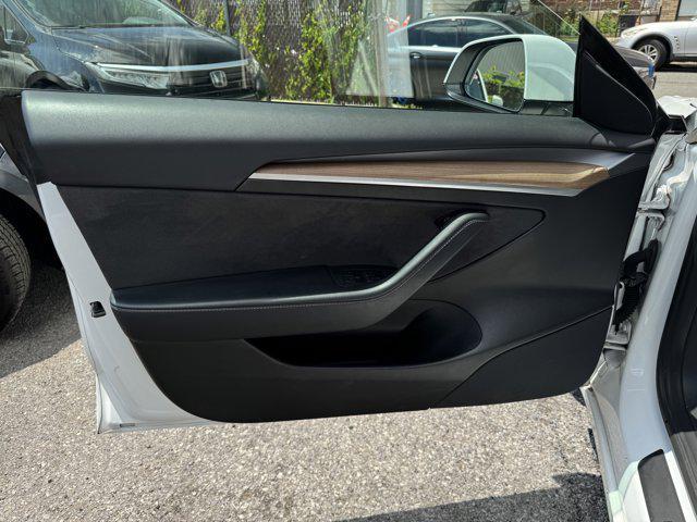 Photo of 2021 Pearl White Multi-Coat Tesla Model 3