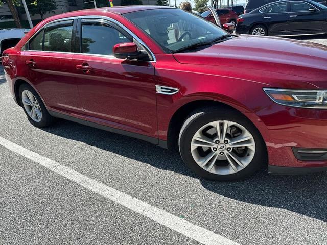 Photo of 2016 Ruby Red Metallic Tinted Clearcoat Ford Taurus