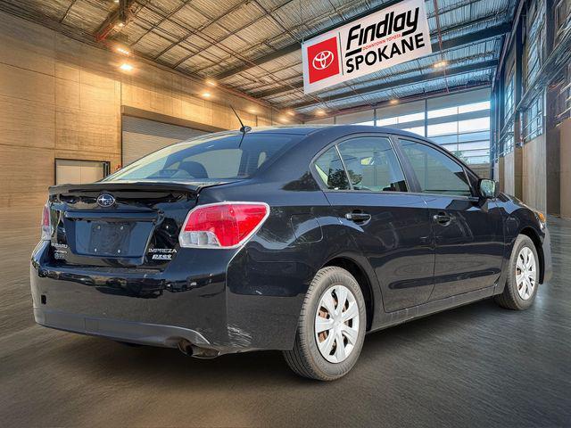 Photo of 2016 Crystal Black Silica Subaru Impreza