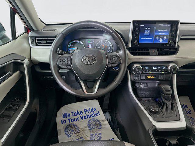 Photo of 2021 Ruby Flare Pearl Toyota RAV4 Hybrid