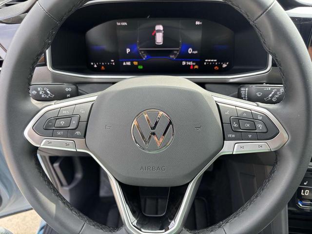 Photo of 2025 Monument Gray w/Deep Black Roof Volkswagen Taos