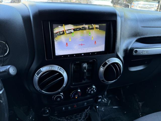 Photo of 2015 Black Clearcoat Jeep Wrangler Unlimited