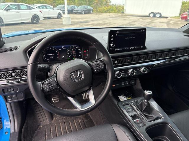 Photo of 2024 Boost Blue Pearl Honda Civic