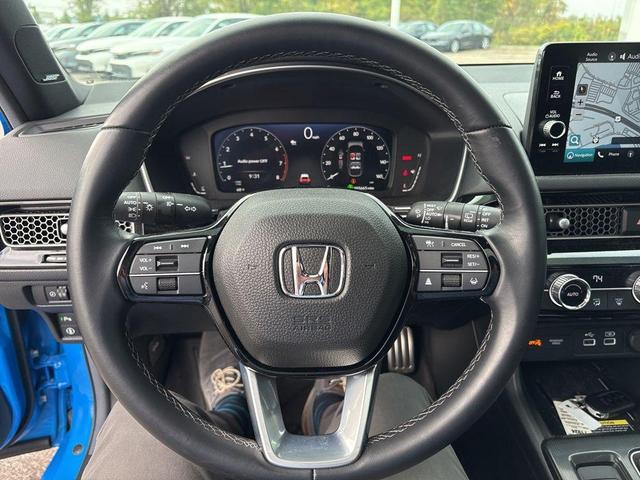 Photo of 2024 Boost Blue Pearl Honda Civic