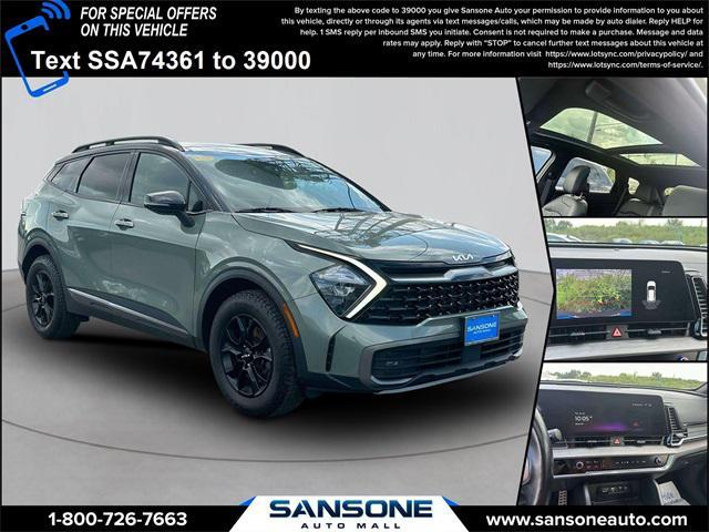 Photo of 2023 Jungle Green/Ebony Black Roof Kia Sportage
