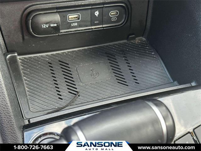Photo of 2023 Jungle Green/Ebony Black Roof Kia Sportage