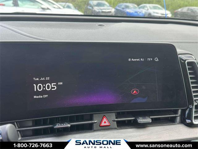 Photo of 2023 Jungle Green/Ebony Black Roof Kia Sportage