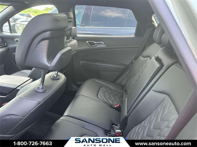 Photo of 2023 Jungle Green/Ebony Black Roof Kia Sportage